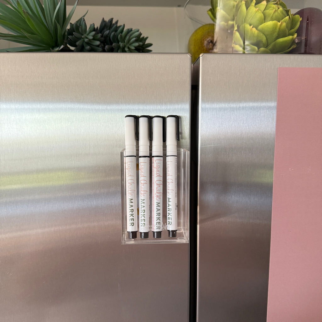 Acrylic Magnet Marker Holder with 4 liquid chalk markers, styled on a stainless steel fridge.