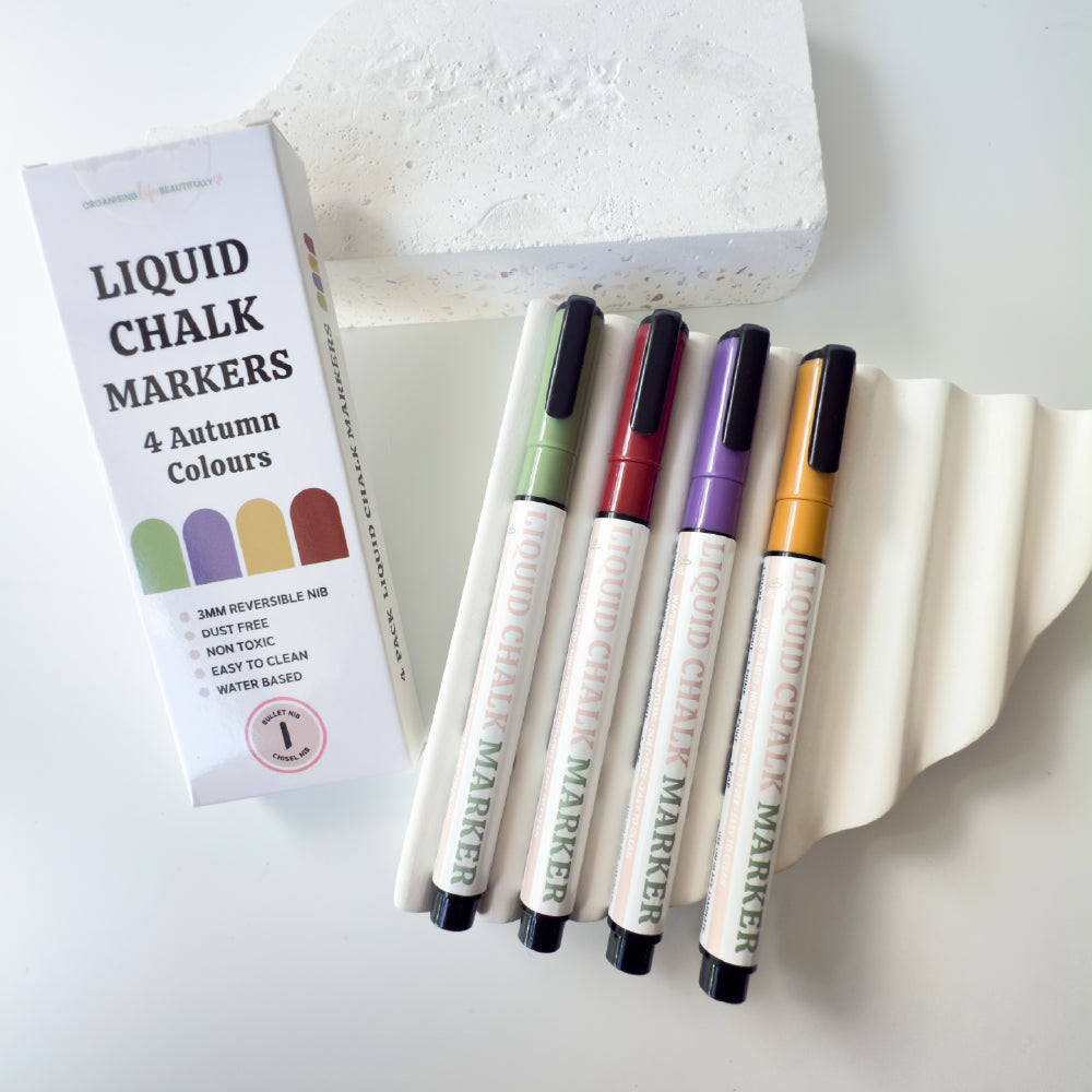 Coloured liquid chalk markers in red yellow purple and green 