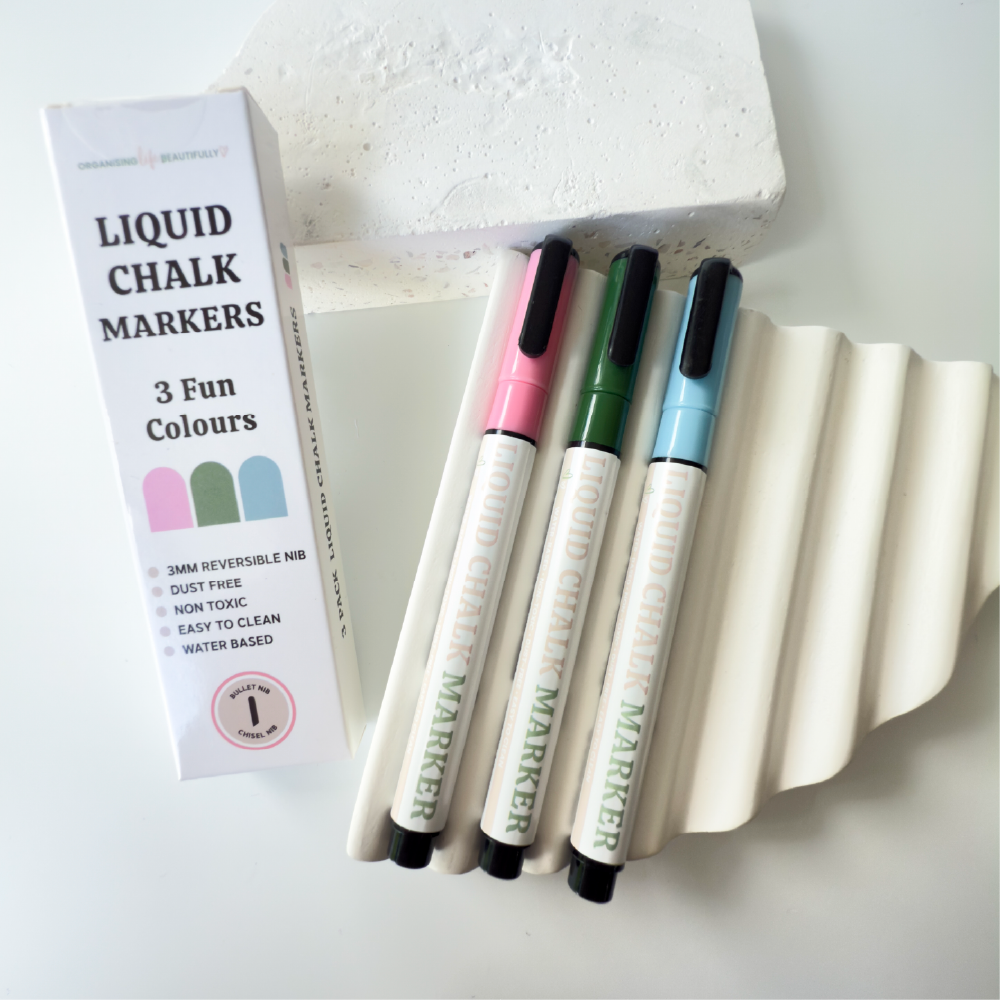 Coloured liquid chalk markers in bold green blue and pink