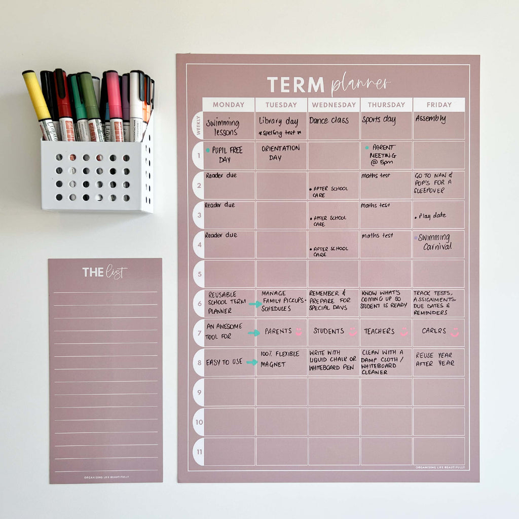 Reusable school term planner magnet in blush pink and white, 11 week term styled on a wall with quote card and marker holder